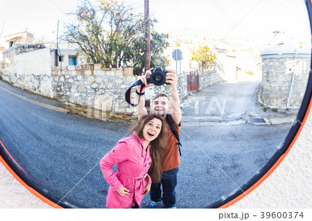 Funny cheerful man and woman are photographed in Funny cheerful man and woman are photographed in 39600374