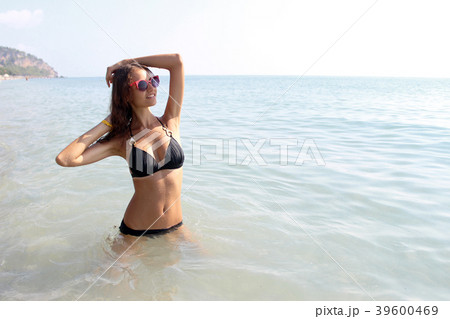 Attractive sexy girl in bikini in sea Attractive sexy girl in bikini in sea 39600469