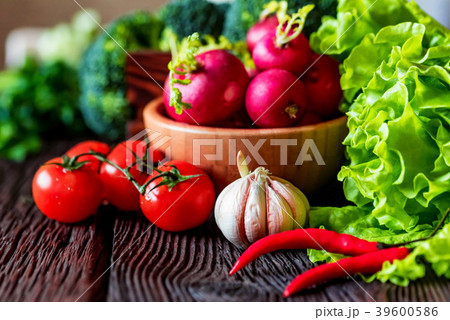 Fresh seasonal vegetables on wooden surface Fresh seasonal vegetables on wooden surface 39600586