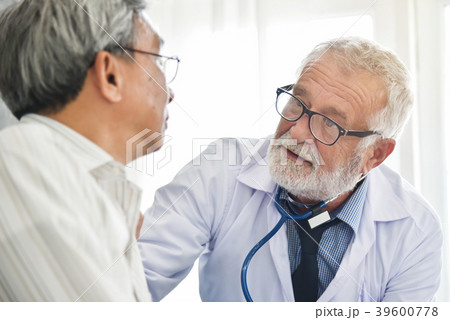 Doctor is talking with Asian male patient. Doctor is talking with Asian male patient. 39600778