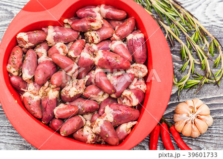 Fresh raw chicken hearts with pepper in bowl 39601733