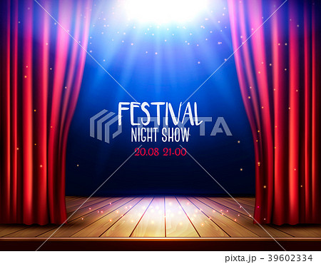 A theater stage with a red curtain and spotlight.  39602334