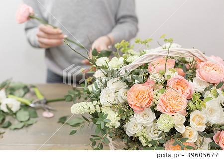 close-up hands female florist. Floral workshop - 39605677
