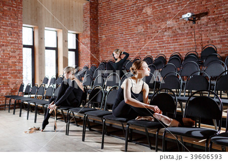 The ballet concept. Young ballerina girls sitting The ballet concept. Young ballerina girls sitting 39606593