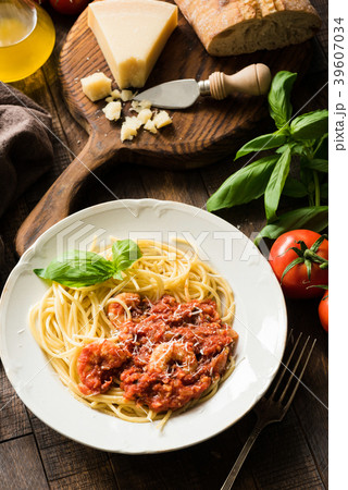 Pasta spaghetti with tomato sauce and shrimps on 39607034