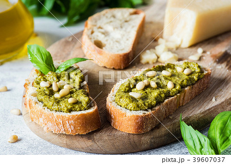 Bruschetta with pesto and pine nuts. Vegetarian 39607037