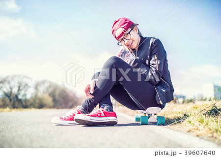 Portrait of young teenage girl on penny board 39607640