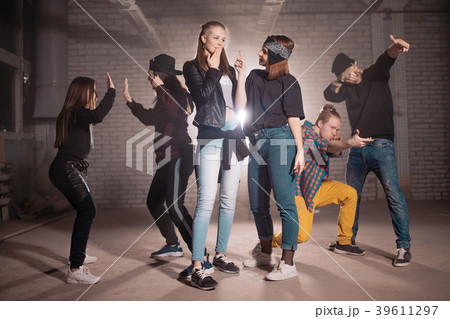 group of yourth is dancing its own role. getting 39611297