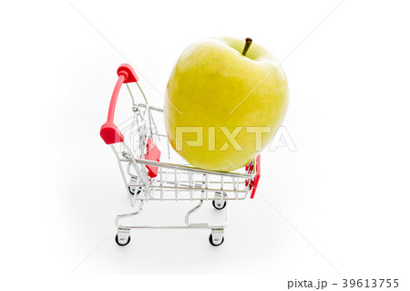 Shopping cart with big green apple on white Shopping cart with big green apple on white 39613755