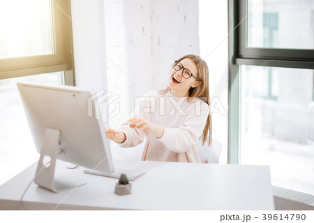 business woman sitting at her workplace and having business woman sitting at her workplace and having 39614790