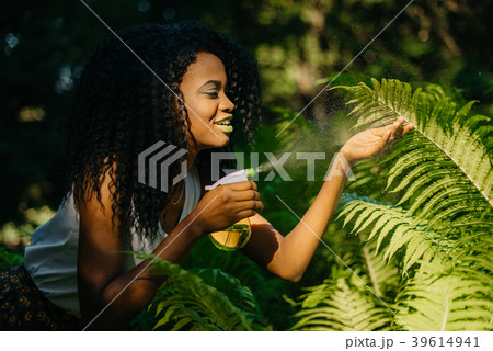Gorgeous young happy african girl with green 39614941