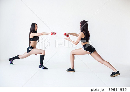 Two beautiful sportive girl friends in sportsuits 39614956