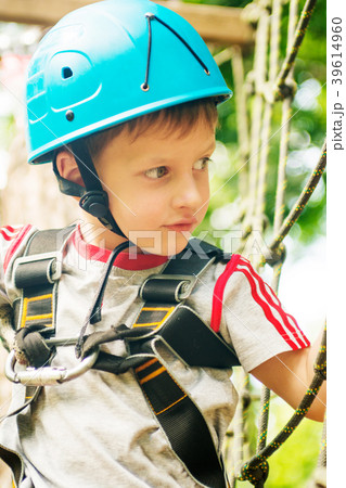 Five year boy on rope-way in forest 39614960