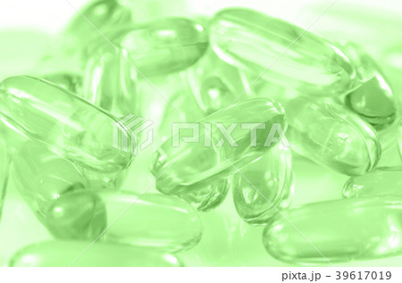 Soft gelatin capsule background. 39617019