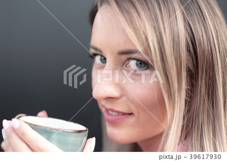 woman drinking coffee in the morning at restaurant woman drinking coffee in the morning at restaurant 39617930