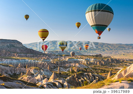 Hot air balloons flying over Cappadocia, Turkey Hot air balloons flying over Cappadocia, Turkey 39617989