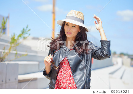 Portrait of happy smiling woman standing on the square on sunny 39618022