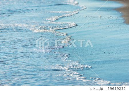 close up of the sea water affecting the sand 39619232