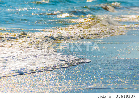 close up of the sea water affecting the sand  39619337