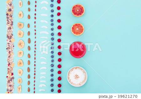 Breakfast with berries and nuts on mint background Breakfast with berries and nuts on mint background 39621270