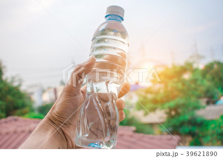 man holding bottle water 39621890
