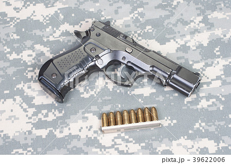 handgun on camouflage uniform 39622006