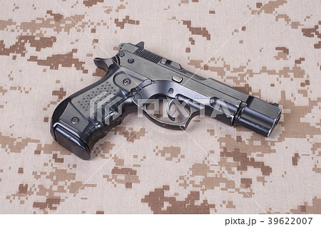 handgun on camouflage uniform 39622007