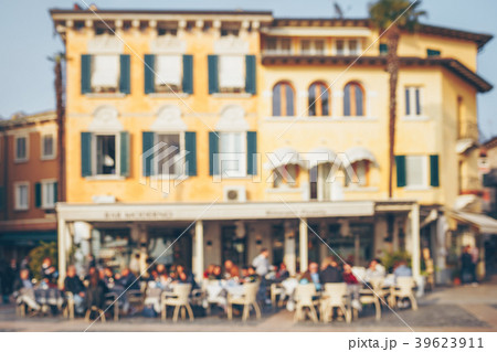 Blurred people in old city street cafe. Blurred people in old city street cafe. 39623911