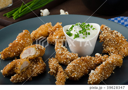 Chicken strips in popcorn breadcrumbs 39628347