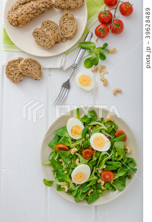 Lamb's lettuce salad with eggs and nuts 39628489