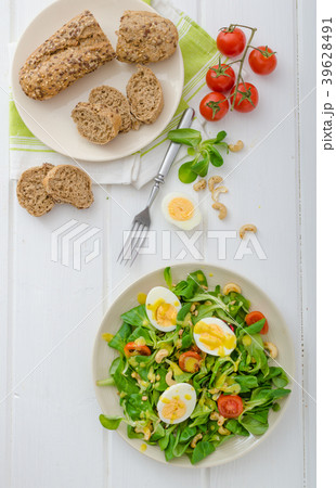 Lamb's lettuce salad with eggs and nuts 39628491