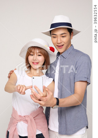 Happy young traveler couple concept photo. set out on a trip to honeymoon, camping and summer vacation concept isolated on white background. 421 Happy young traveler couple concept photo. set out on a trip to honeymoon, camping and summer vacation concept isolated on white background. 421 39632554