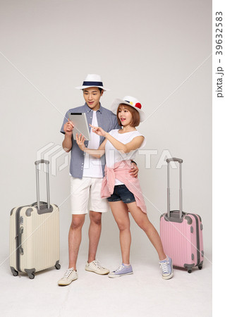 Happy young traveler couple concept photo. set out on a trip to honeymoon, camping and summer vacation concept isolated on white background. 426 Happy young traveler couple concept photo. set out on a trip to honeymoon, camping and summer vacation concept isolated on white background. 426 39632583