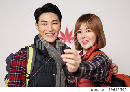 Happy young traveler couple concept photo. set out on a trip to honeymoon, camping and summer vacation concept isolated on white background. 393 Happy young traveler couple concept photo. set out on a trip to honeymoon, camping and summer vacation concept isolated on white background. 393 39632595