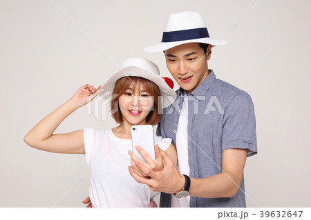 Happy young traveler couple concept photo. set out on a trip to honeymoon, camping and summer vacation concept isolated on white background. 420 Happy young traveler couple concept photo. set out on a trip to honeymoon, camping and summer vacation concept isolated on white background. 420 39632647