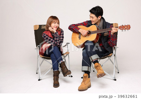 Happy young traveler couple concept photo. set out on a trip to honeymoon, camping and summer vacation concept isolated on white background. 414 Happy young traveler couple concept photo. set out on a trip to honeymoon, camping and summer vacation concept isolated on white background. 414 39632661