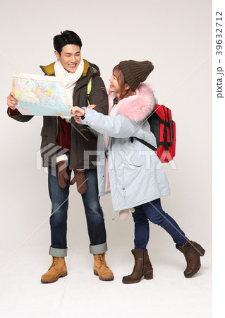Happy young traveler couple concept photo. set out on a trip to honeymoon, camping and summer vacation concept isolated on white background. 279 Happy young traveler couple concept photo. set out on a trip to honeymoon, camping and summer vacation concept isolated on white background. 279 39632712