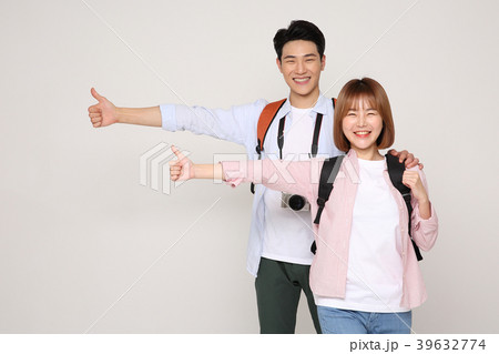 Happy young traveler couple concept photo. set out on a trip to honeymoon, camping and summer vacation concept isolated on white background. 197 Happy young traveler couple concept photo. set out on a trip to honeymoon, camping and summer vacation concept isolated on white background. 197 39632774