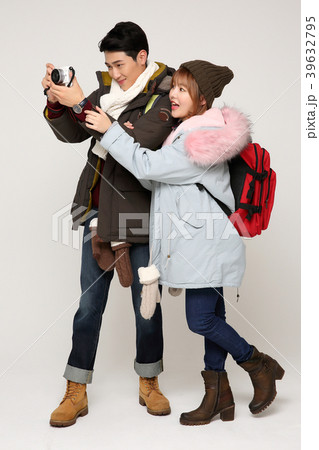 Happy young traveler couple concept photo. set out on a trip to honeymoon, camping and summer vacation concept isolated on white background. 303 Happy young traveler couple concept photo. set out on a trip to honeymoon, camping and summer vacation concept isolated on white background. 303 39632795