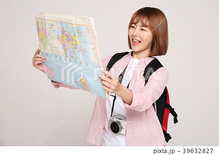 Young traveler woman with a backpack concept isolated on White photo. 117 39632827