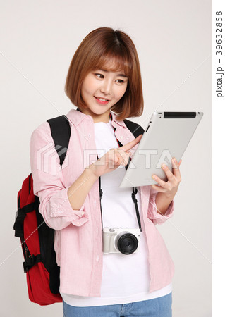 Young traveler woman with a backpack concept isolated on White photo. 102 Young traveler woman with a backpack concept isolated on White photo. 102 39632858