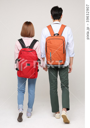 Happy young traveler couple concept photo. set out on a trip to honeymoon, camping and summer vacation concept isolated on white background. 157 Happy young traveler couple concept photo. set out on a trip to honeymoon, camping and summer vacation concept isolated on white background. 157 39632907