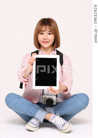 Young traveler woman with a backpack concept isolated on White photo. 111 39632929