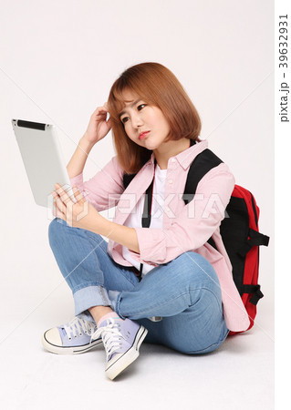 Young traveler woman with a backpack concept isolated on White photo. 110 Young traveler woman with a backpack concept isolated on White photo. 110 39632931