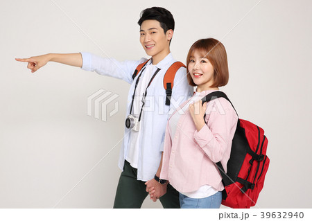 Happy young traveler couple concept photo. set out on a trip to honeymoon, camping and summer vacation concept isolated on white background. 191 Happy young traveler couple concept photo. set out on a trip to honeymoon, camping and summer vacation concept isolated on white background. 191 39632940