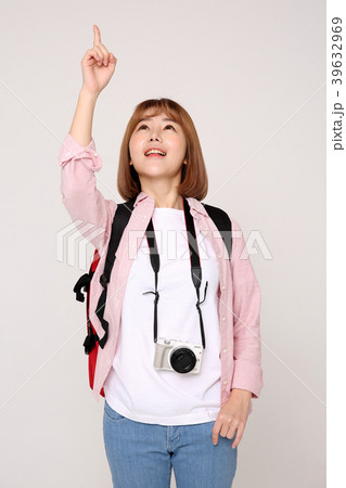 Young traveler woman with a backpack concept isolated on White photo. 053 Young traveler woman with a backpack concept isolated on White photo. 053 39632969