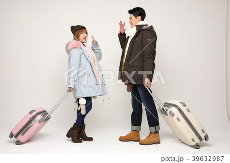 Happy young traveler couple concept photo. set out on a trip to honeymoon, camping and summer vacation concept isolated on white background. 323 Happy young traveler couple concept photo. set out on a trip to honeymoon, camping and summer vacation concept isolated on white background. 323 39632987