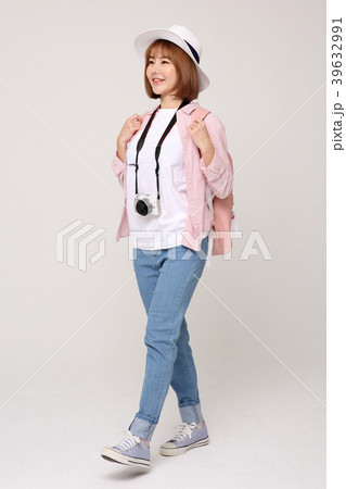 Young traveler woman with a backpack concept isolated on White photo. 005 39632991
