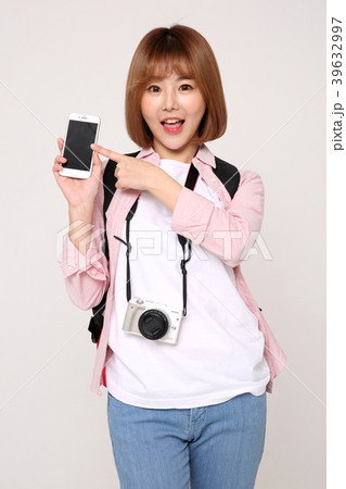 Young traveler woman with a backpack concept isolated on White photo. 060 Young traveler woman with a backpack concept isolated on White photo. 060 39632997