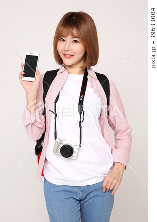 Young traveler woman with a backpack concept isolated on White photo. 059 Young traveler woman with a backpack concept isolated on White photo. 059 39633004
